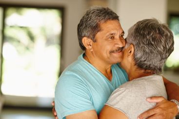Care, senior or happy couple hug in home for support,...