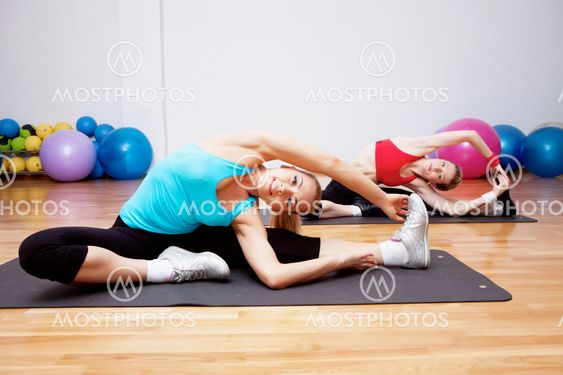 Two stretching girls