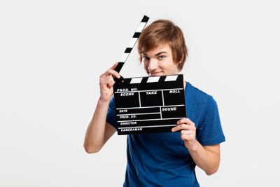 Holding a clapboard