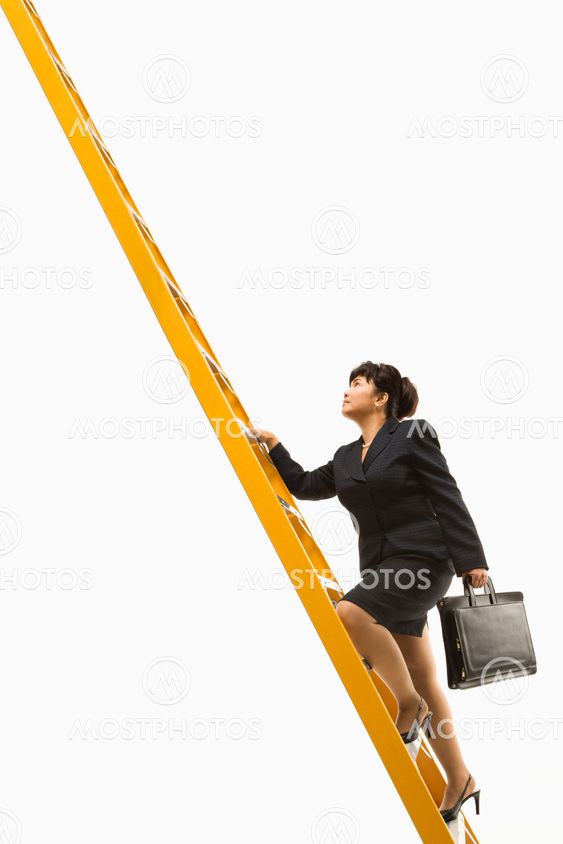 Businesswoman climbing ladder.