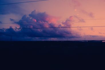 From the train window, the evening landscape and purple...