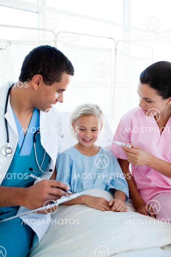 A nurse taking her patient's temperature in a hospital