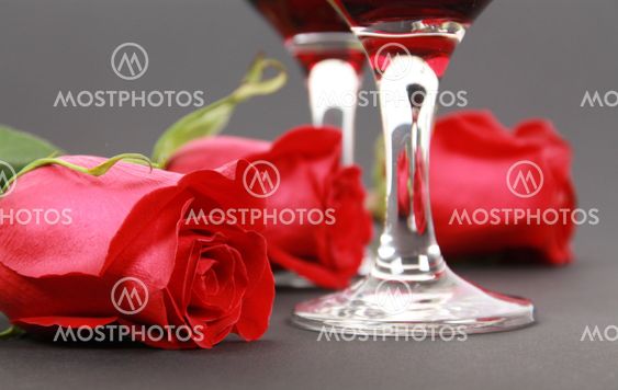 Wine in glasses with a rose
