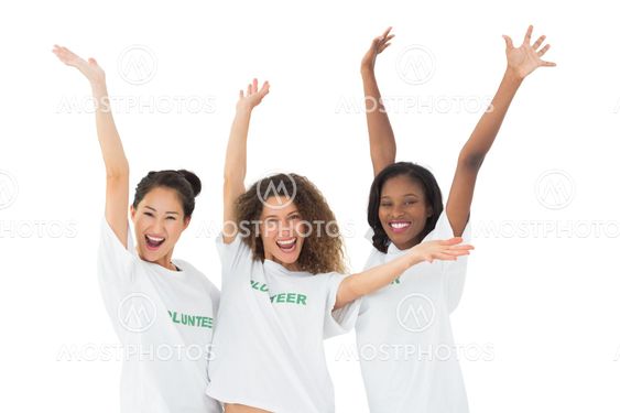 Attractive team of volunteers waving at camera