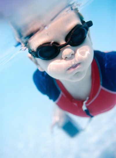 Little boy swimming underwater