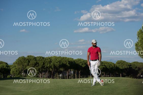 handsome middle eastern golf player portrait at course