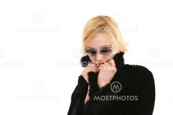 Blonde woman in long black coat