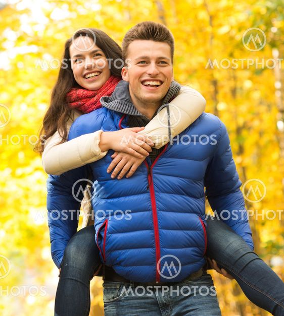 smiling friends having fun in autumn park