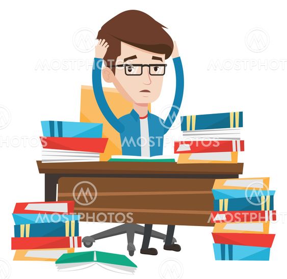 Student sitting at the table with piles of books.