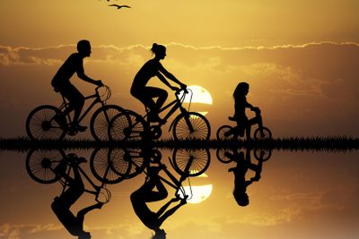 Family Cycling at sunset