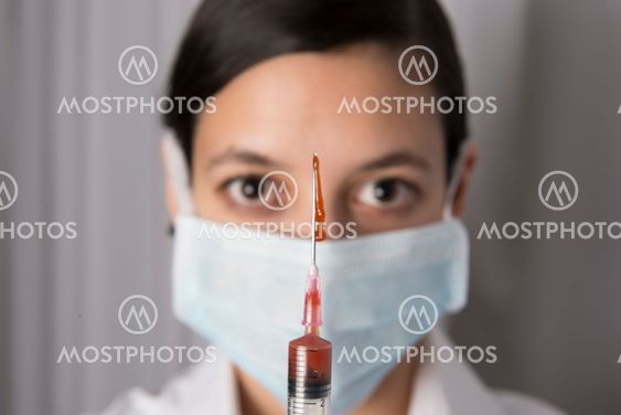 Beautiful women holding syringe