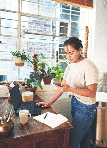 Asian woman, pottery and designer with technology for...
