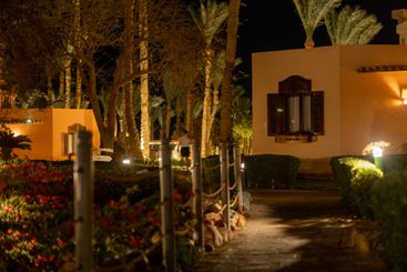 Serene evening stroll through a beautifully lit resort...