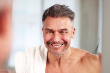 Close-up Of A Man Washing Face