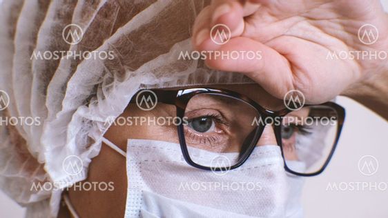 The woman doctor put her hand to her head, a migraine...