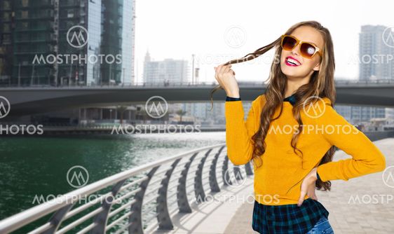 happy young woman or teen girl in casual clothes