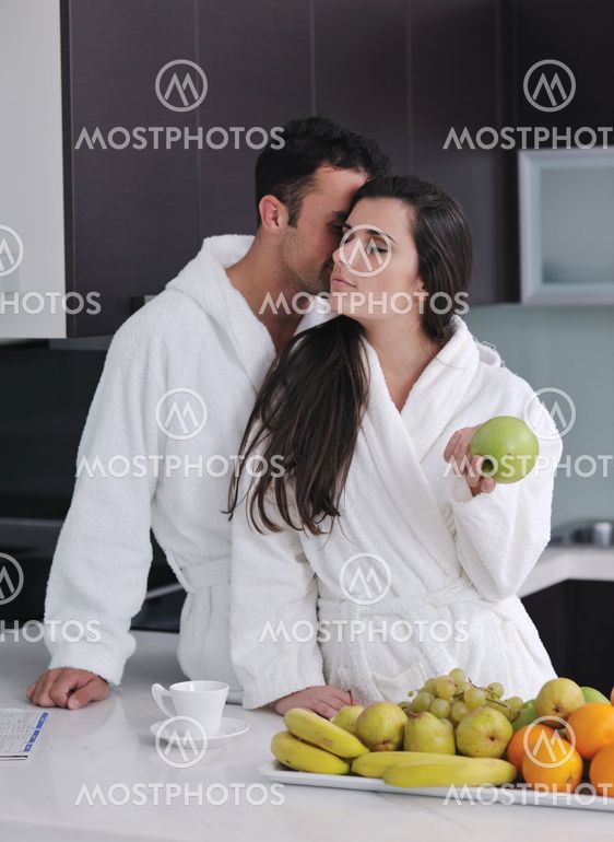 young couple have fun in modern kitchen