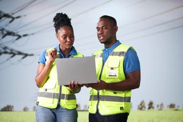Engineers Using Computer Technology New Energy Tower
