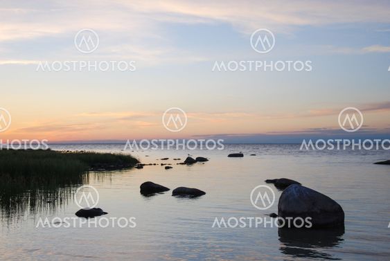 Calm coast by the setting sun