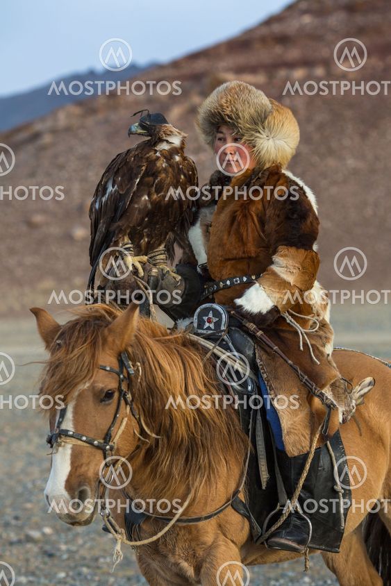 Golden Eagle Hunter teaches her young daughter hunting...