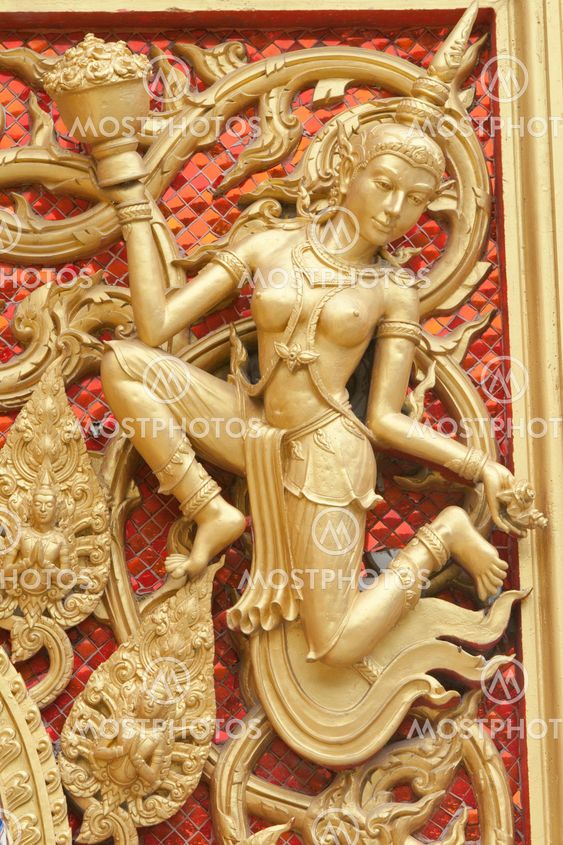 the gold stucco design of native thai style on the Wall