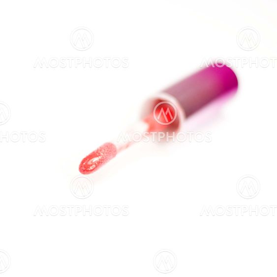 Applicator for lip gloss on a white background