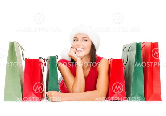 woman in red shirt with shopping bags