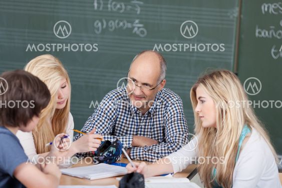 Teacher and his students in a group discussion