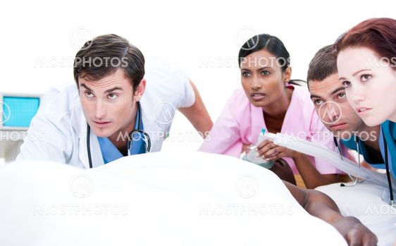 Confident medical team resuscitating a patient
