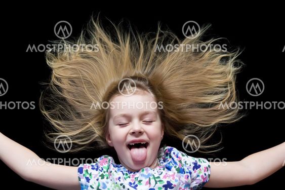 Girl imitate witch and put out tongue