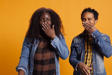 Cute romantic married couple sending air kisses and...