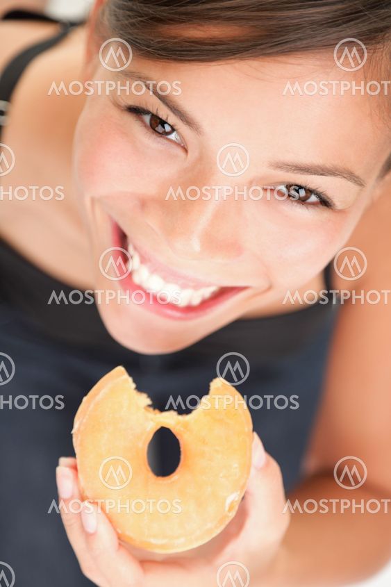 Woman eating donut