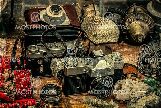 Old postcards with old photo cameras and different antiques