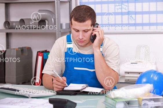 Man checking stock and ordering new parts