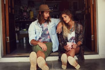 Doorway, shop and couple with coffee, relax and tourism...