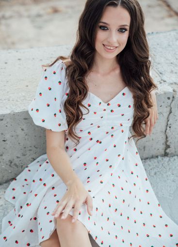 Beautiful slim fashion brunette woman in polka dot...