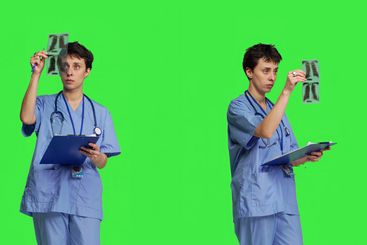 Medical specialist examines x ray scan in hospital...