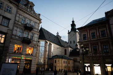 Evening streetscape with historical architecture and...