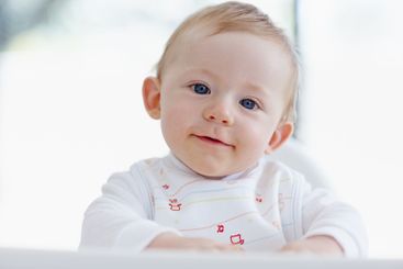 Baby, boy and portrait in home chair, morning breakfast...