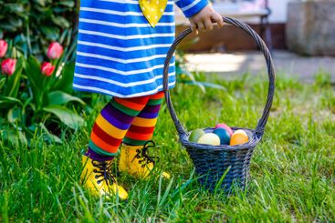 Close-up of of toddler girl with colorful stockings and...