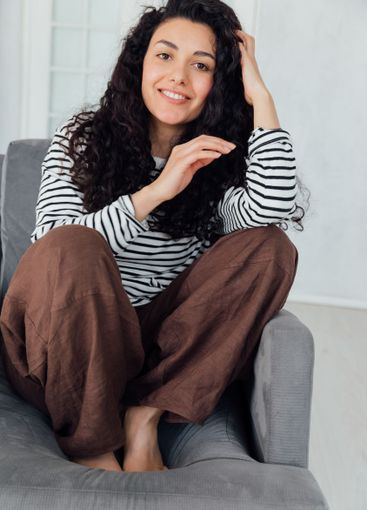 Beautiful slender brunette woman smiling sweetly