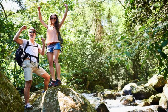 Weve done it. a young couple hiking through the forest.