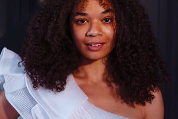 Close-up portrait of a young laughing African woman...
