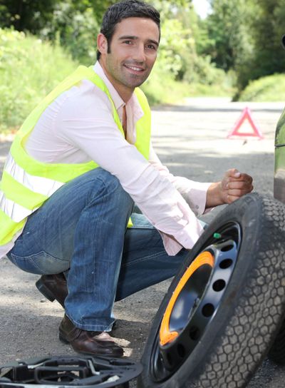 man changing a wheel