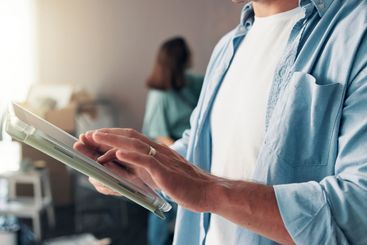 Diy, tablet and hands of man in home painting for...