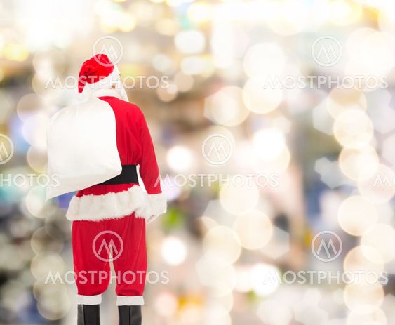 man in costume of santa claus with bag
