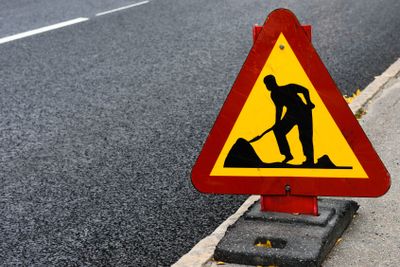 Roadwork sign at the side of a road