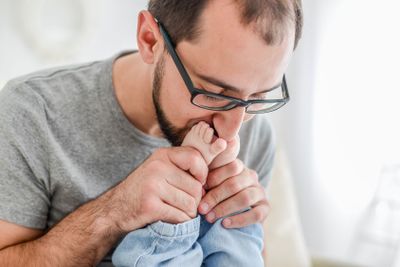 Dad playing with baby