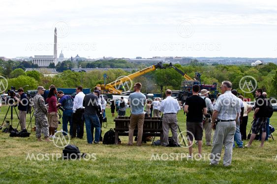 People waiting for Space shuttle Discovery, to fly over the Washington, D.C. area