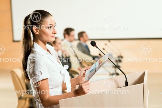 Portrait of a business woman with microphone